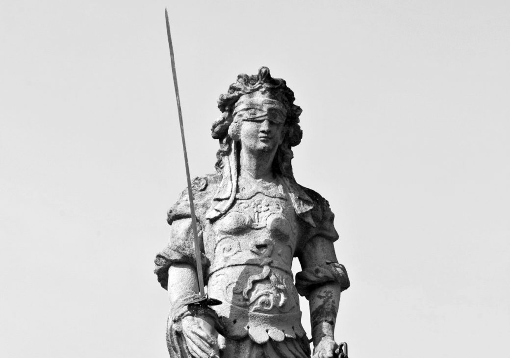 stone statue holding sword