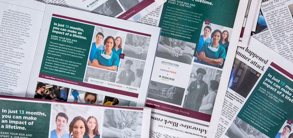 Top down photo of various print ads that Asher placed on behalf of Indiana Tech, Huntington University and Parkview Health for their new nursing program.