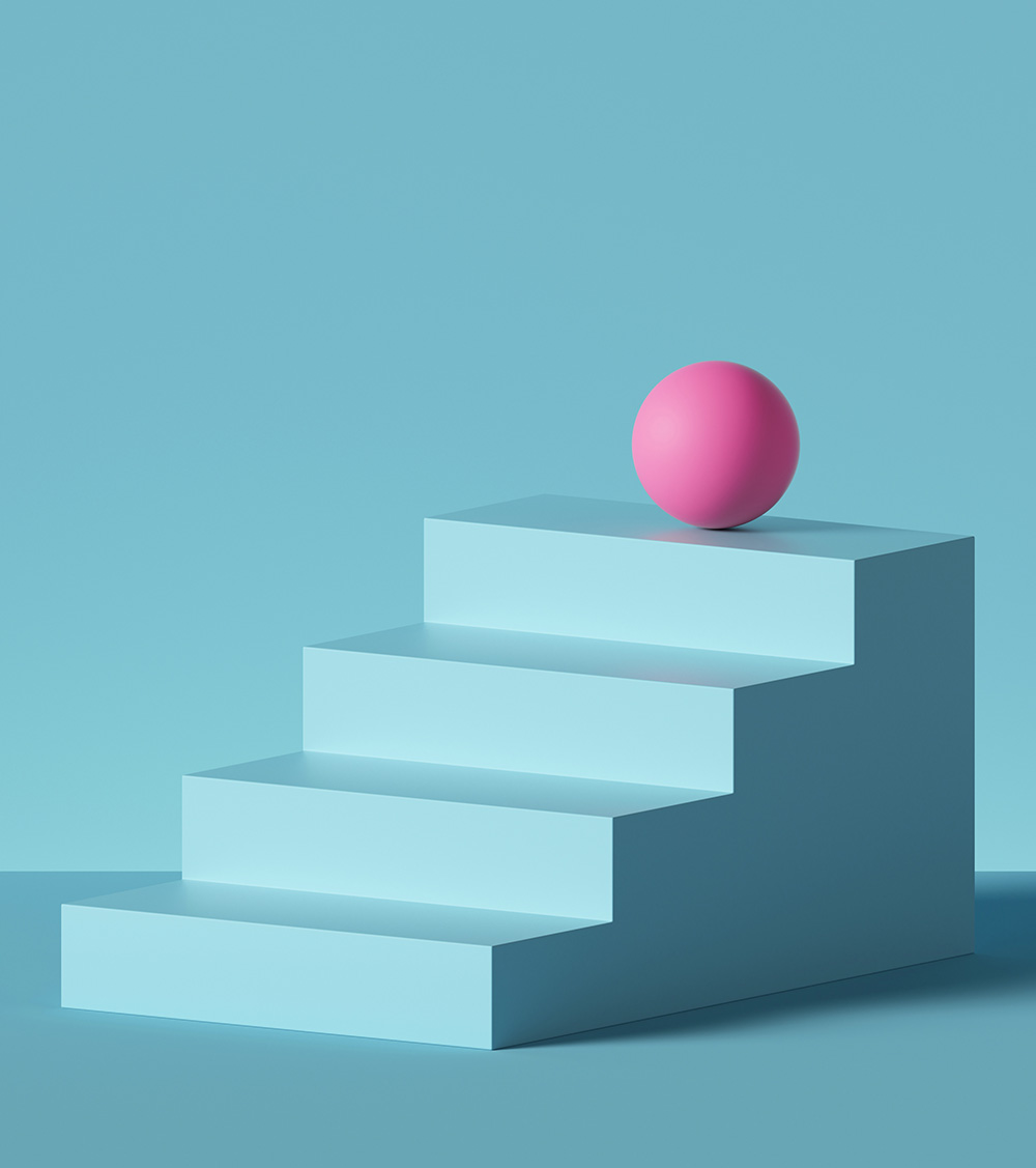 Pink ball placed on blue steps, isolated stairs.