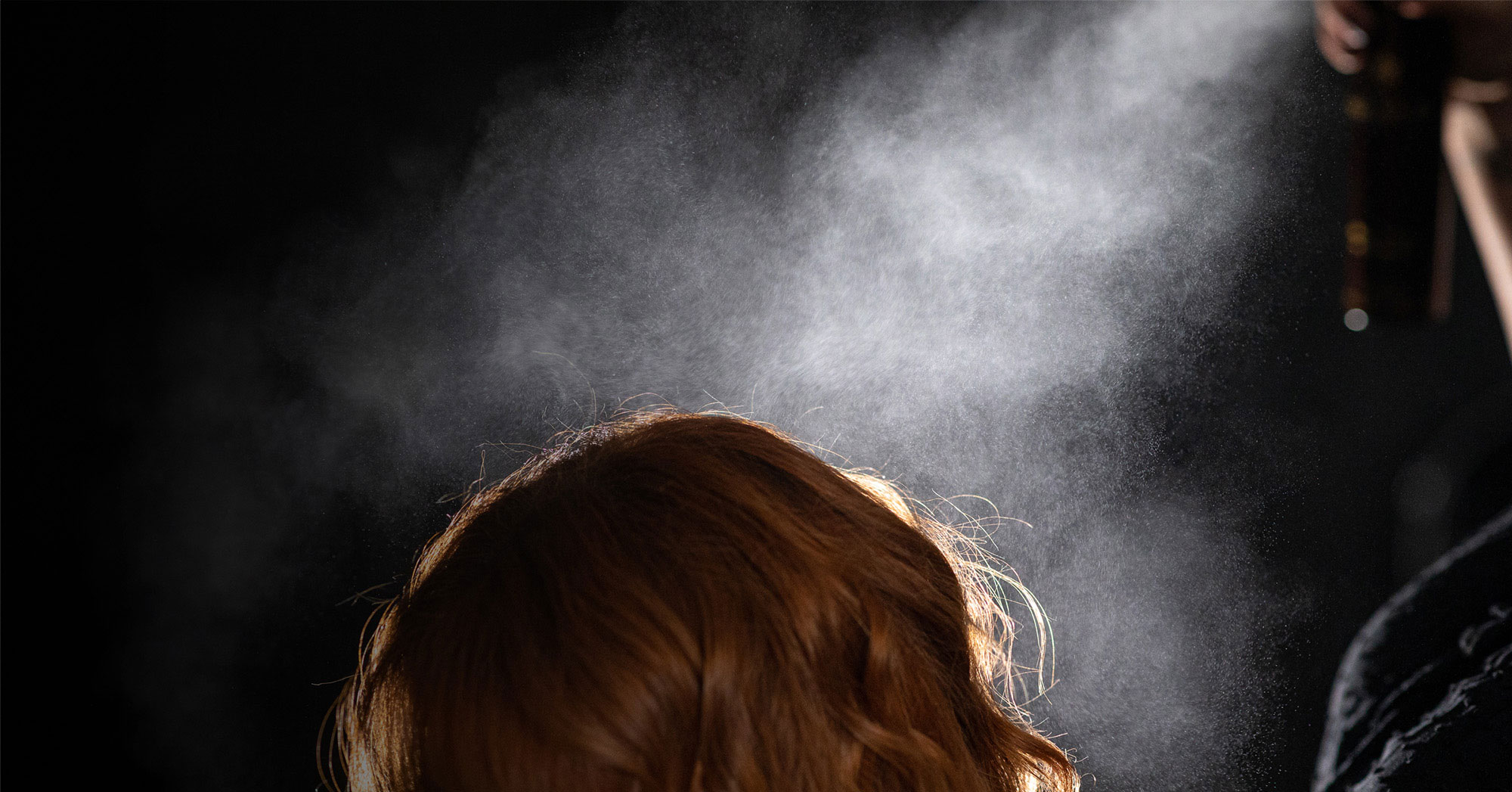 Woman's hair being misted