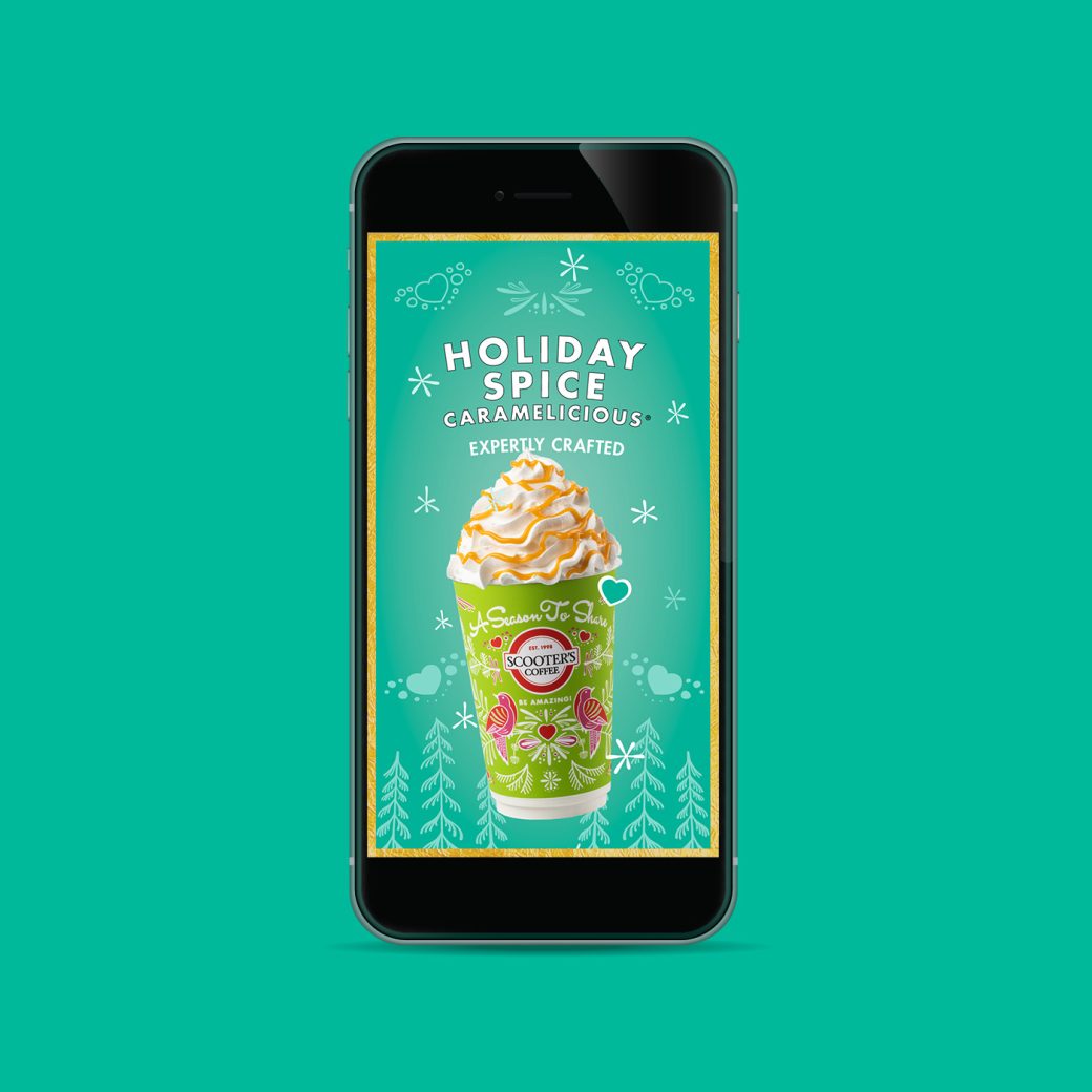 Phone showing a coffee advertisement saying "Holiday Spice Caramelicious, Expertly Crafted."