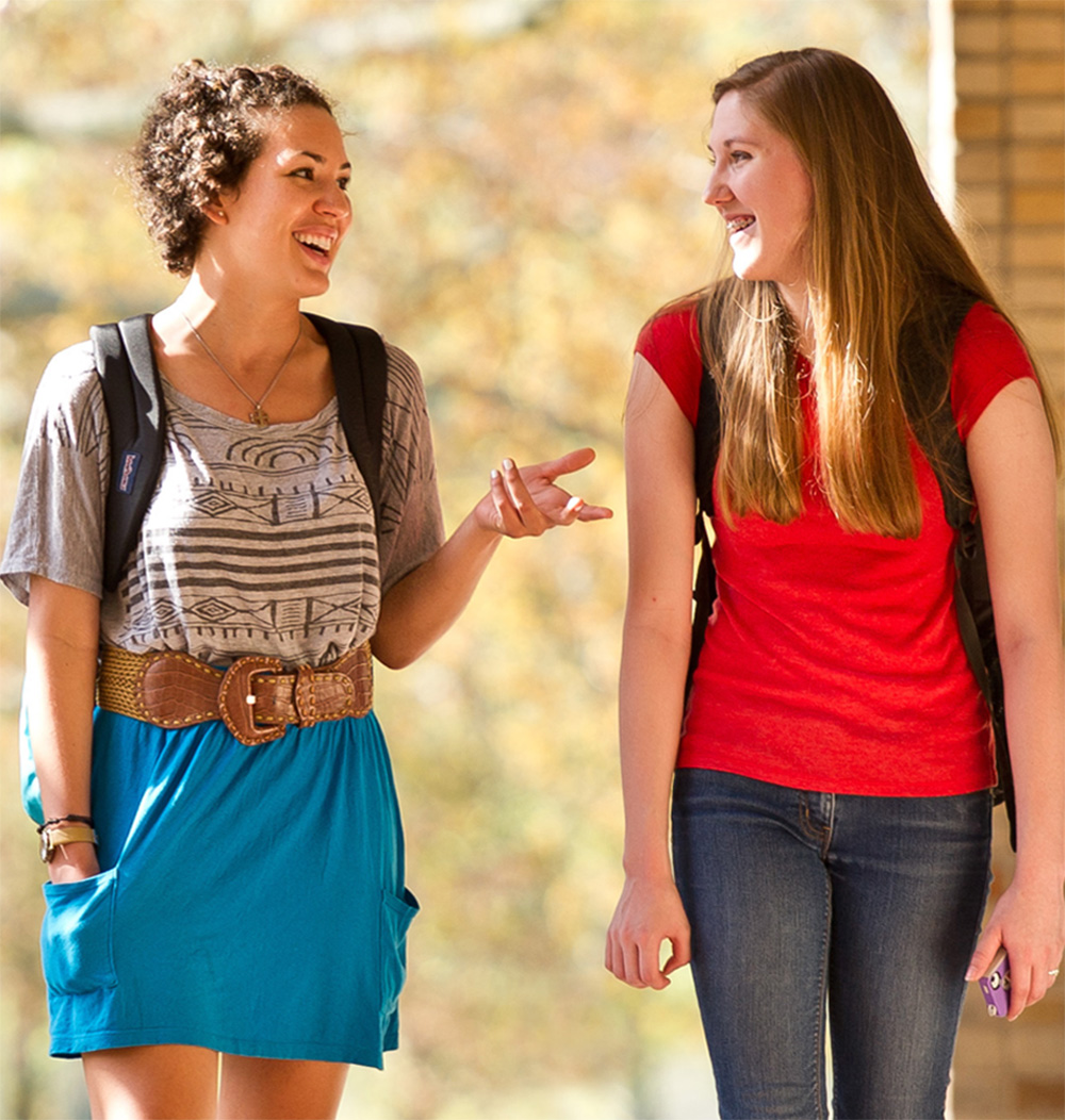 Two students laughing