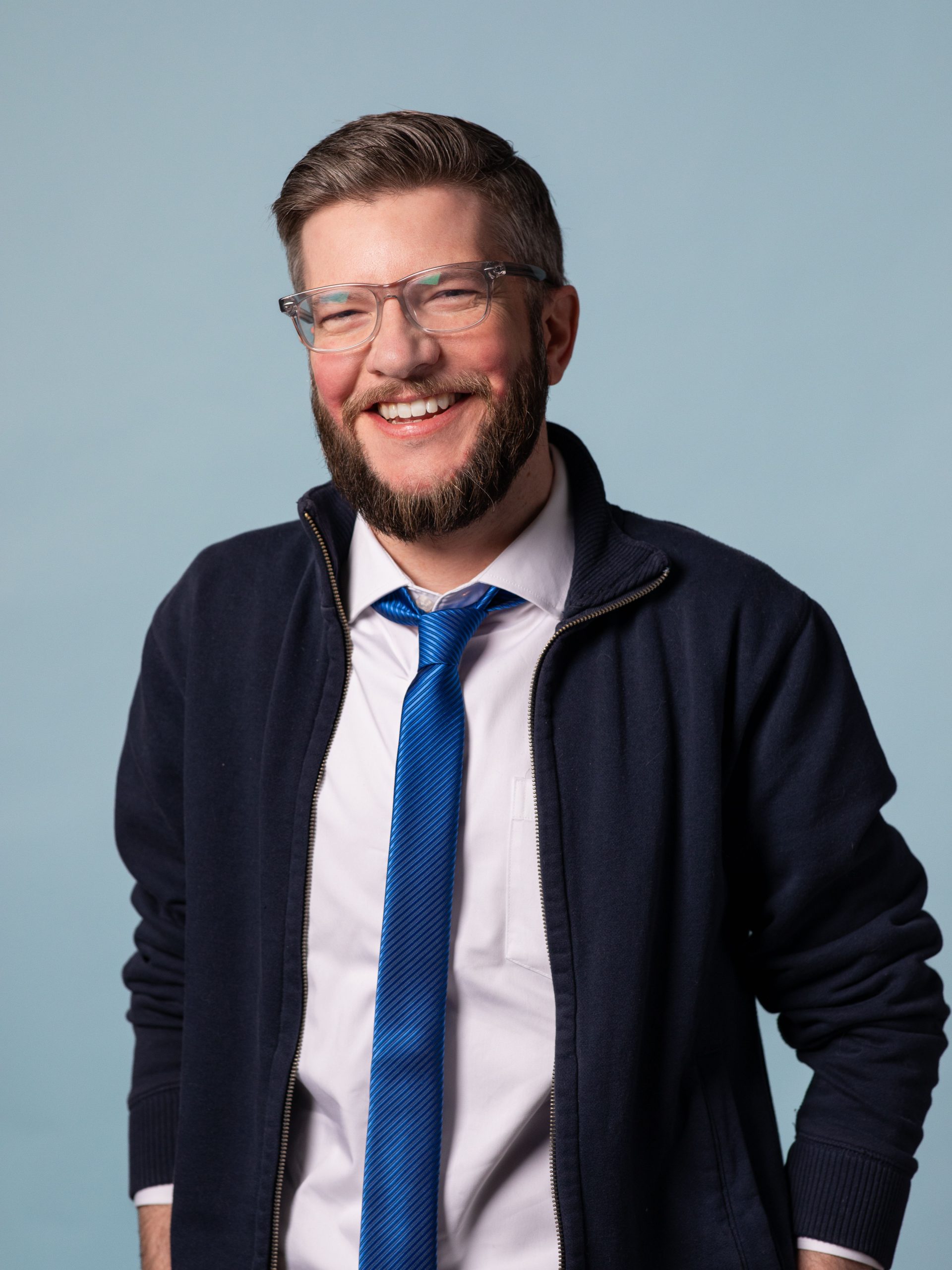 Ben Reynolds, Asher Agency Web Developer, wearing a blue tie