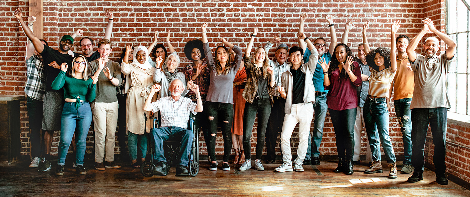 People raising their hands and cheering