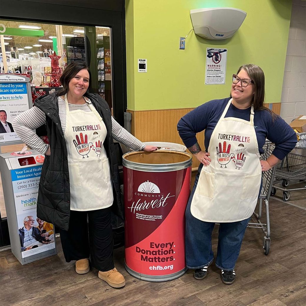 Molly Link and Kirsten Hamrick Hinkson collecting turkeys for Community Harvest Food Bank's turkey rally.