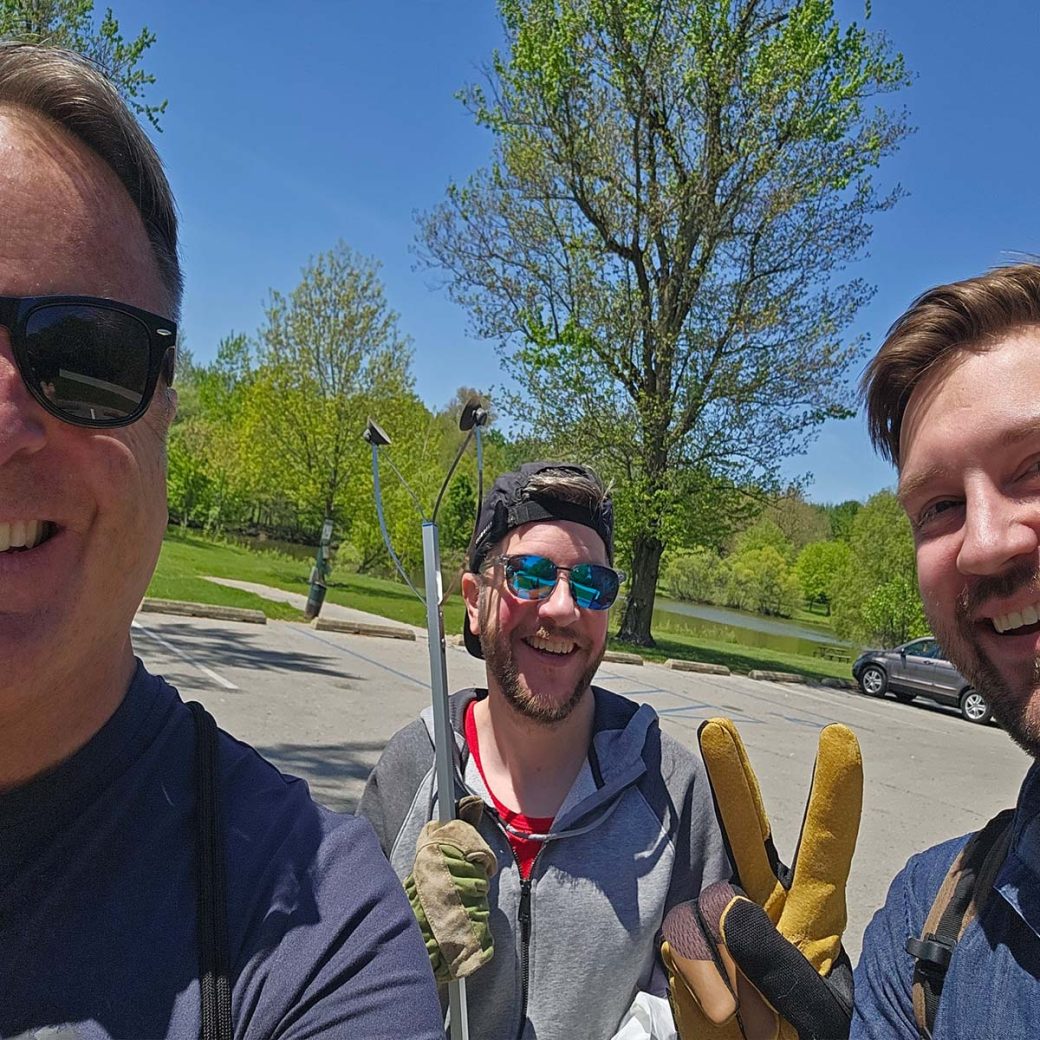 Anthony Juliano, Ben Reynolds and Sean O'Leary pose for a photo outdoors.