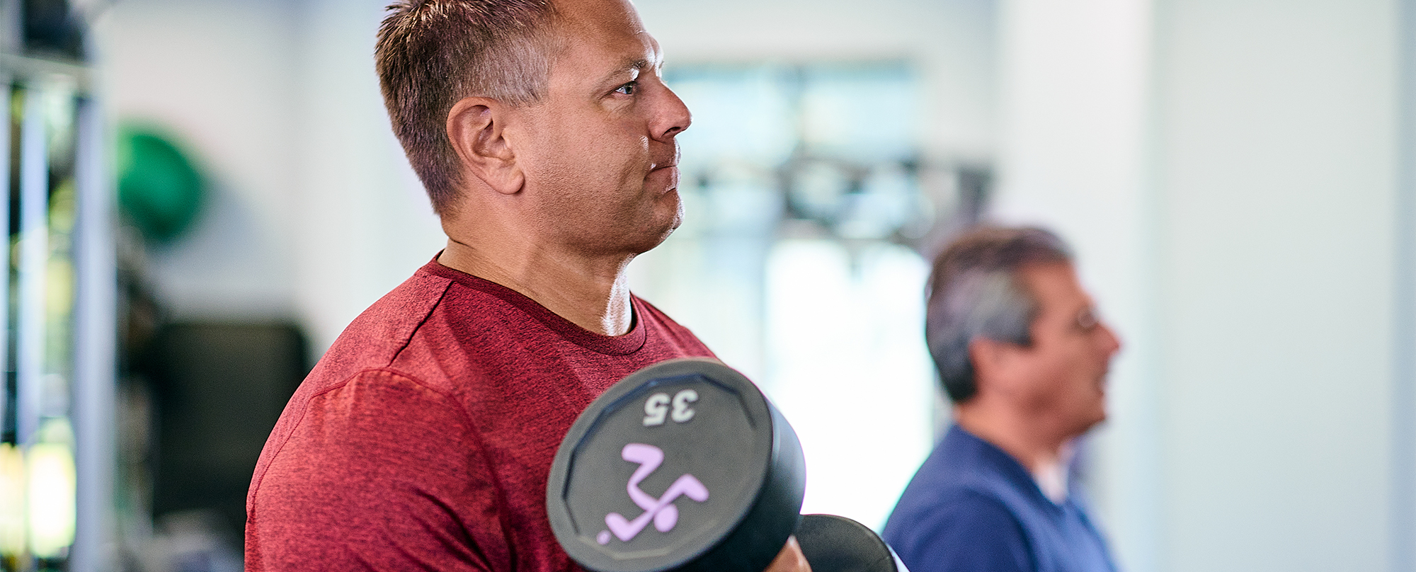 man lifting weights