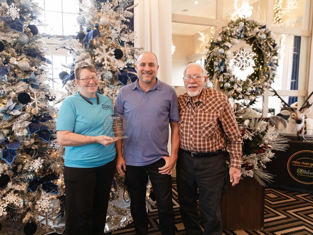 Natasha Zoe of JarHead Farm; Matt Nichols, business advisor; and Stan Loder, also of the farm at the award presentation for Survivor Bee of the Year.