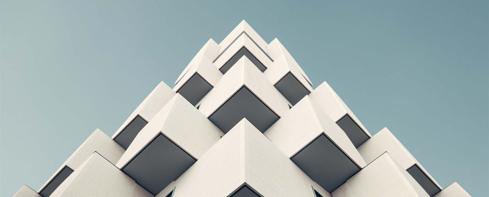 Perspective of modern glass and concrete building.
